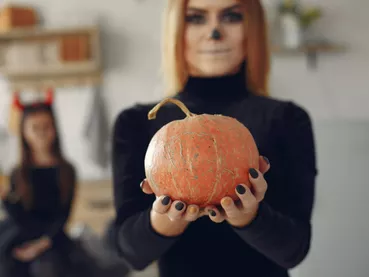 Mother with daughter in a halloween costume and makeup Mother with daughter in a halloween costume and makeup