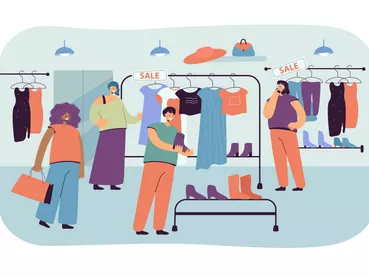 Happy women choosing clothes in store